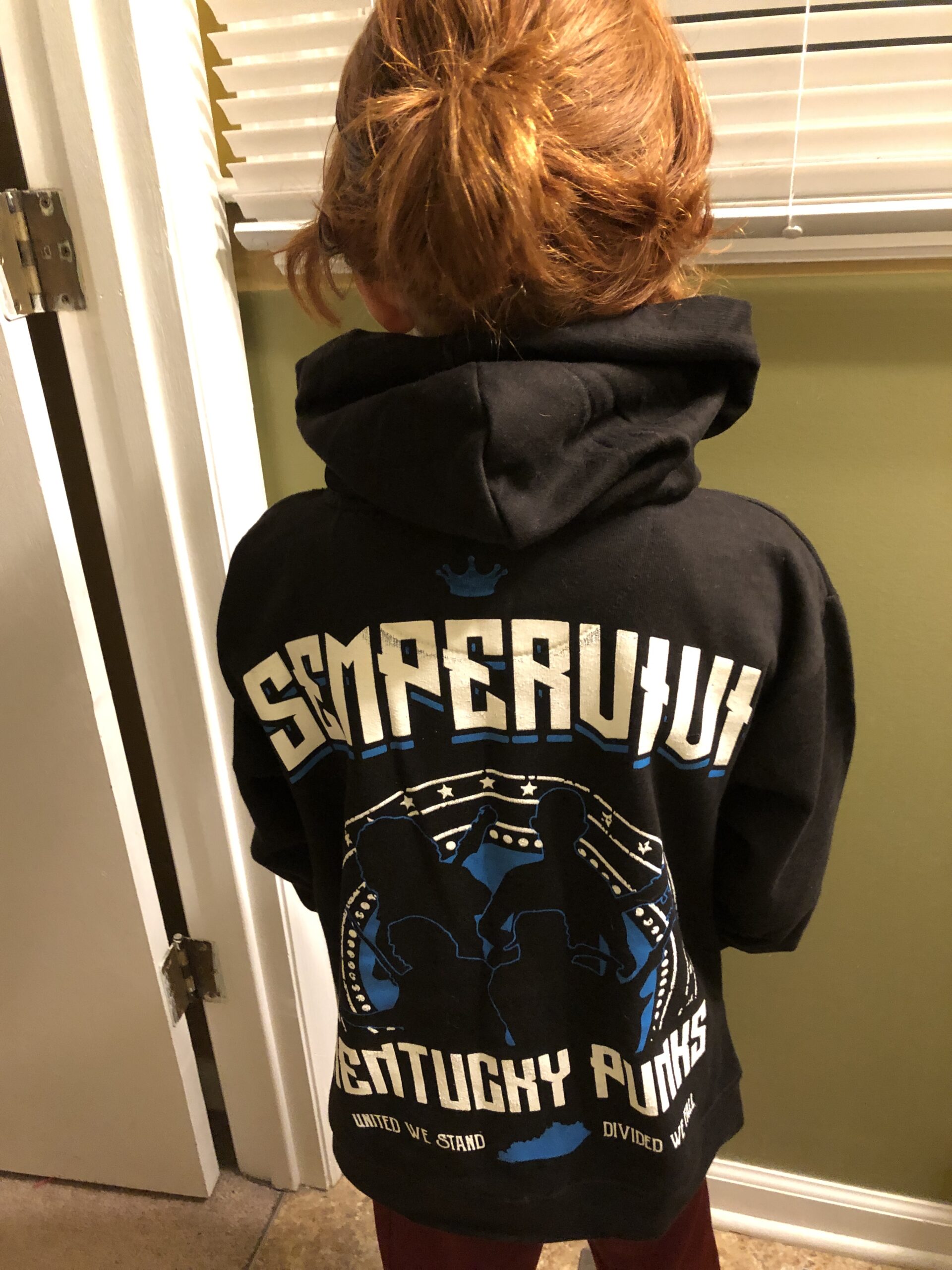 Parker models the back of his Sempervivi hoodie