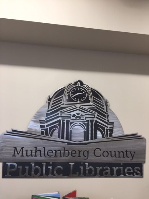 Muhlenberg County Public Libraries logo metal sign