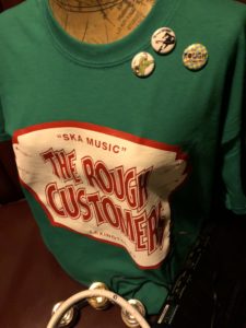 Rough Customers band shirt design on display at their merch table.